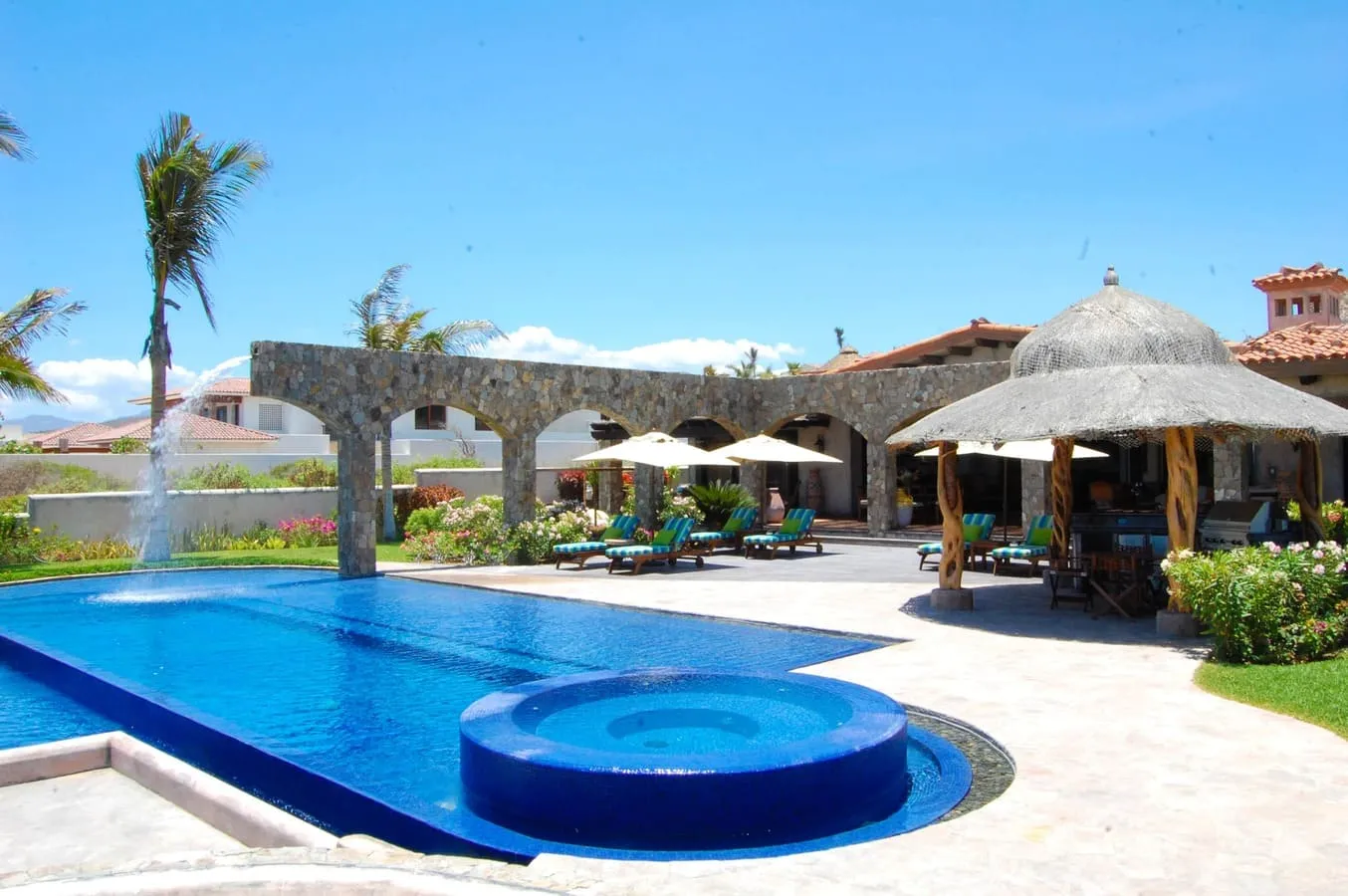 Pool and outdoor terrace at Villa Estero in Puerto Los Cabos