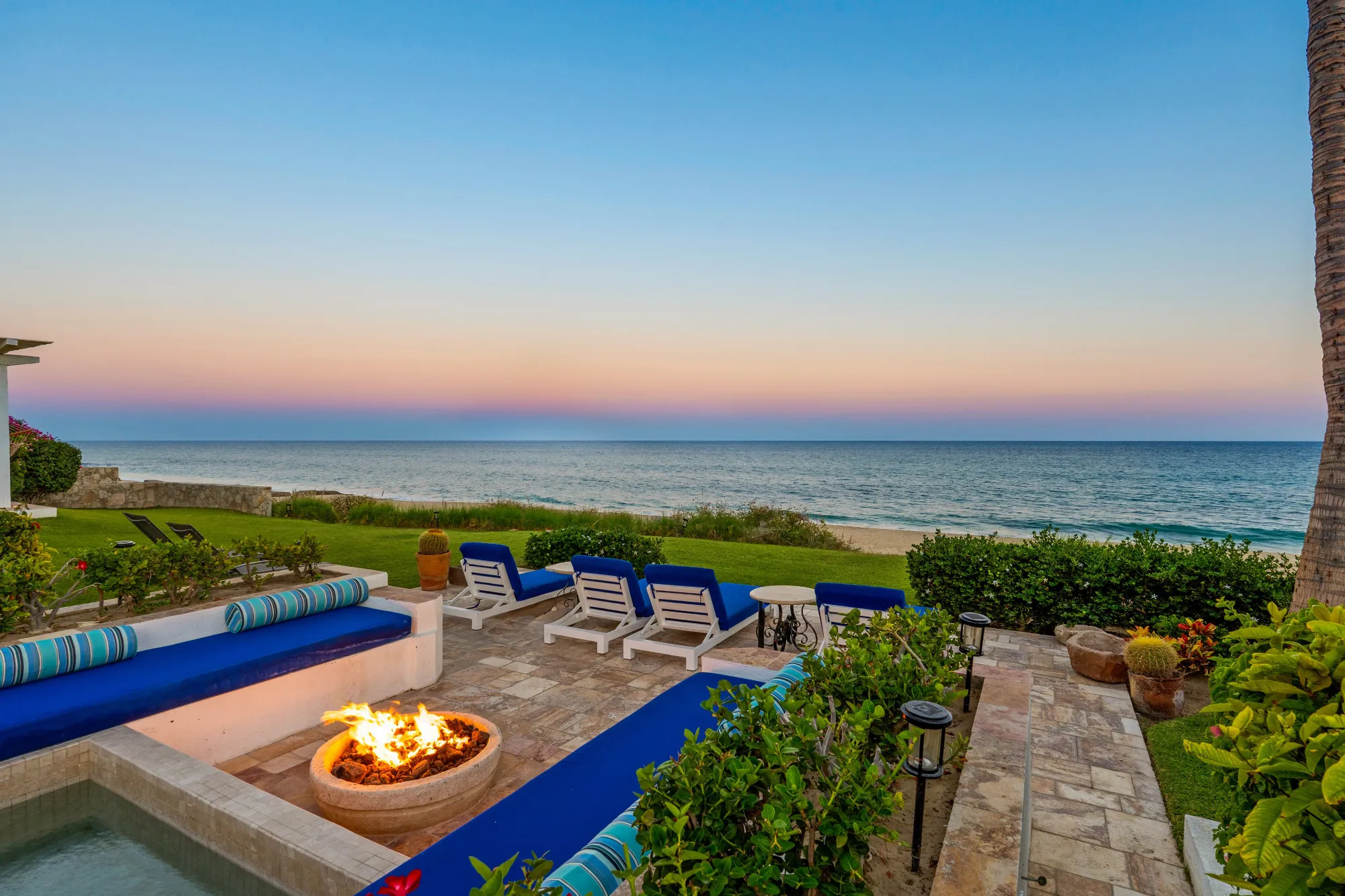 Oceanfront terrace at Villa Piedra Blanca in Puerto Los Cabos at sunset