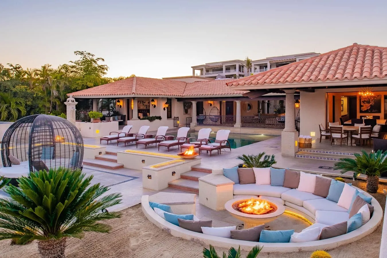 Outdoor lounge and circular fire pit at Casa Brooks in Cabo del Sol