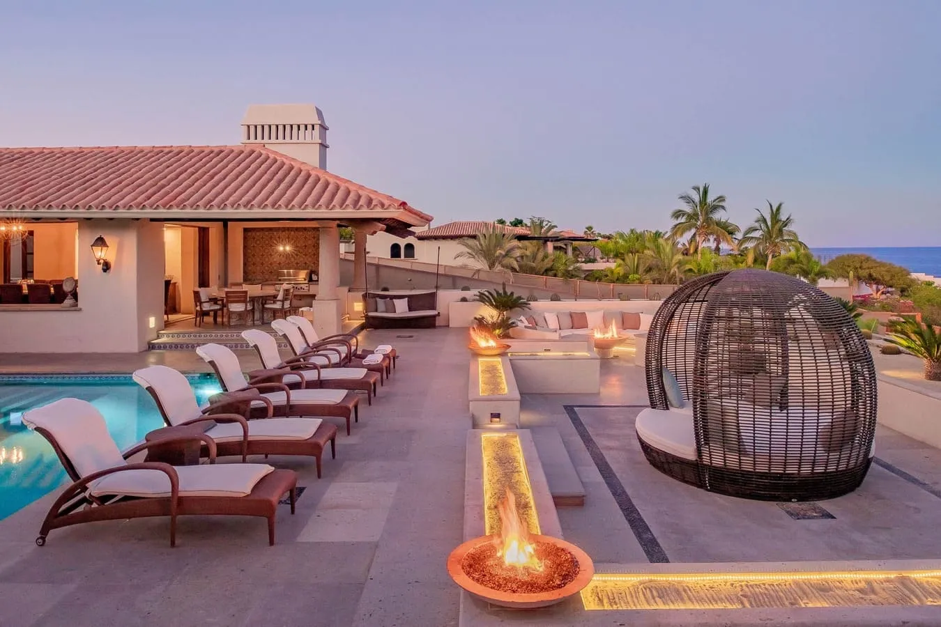 Casa Brooks pool terrace with fire pits and ocean views in Cabo del Sol