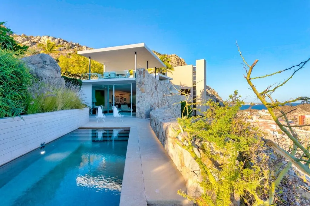Casa Finisterra exterior with private pool and hillside views in Pedregal