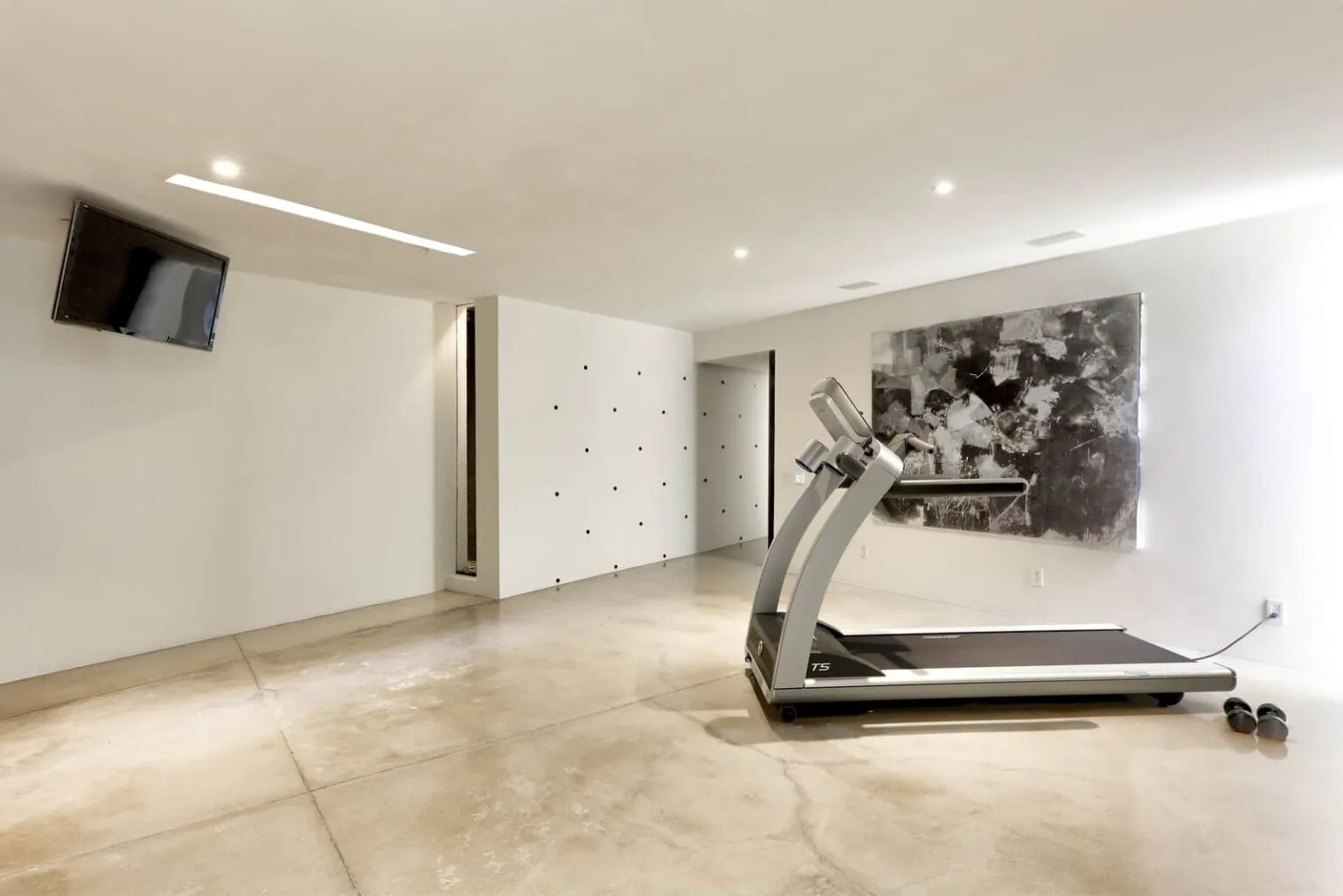 Private gym with treadmill inside Casa Finisterra in Cabo San Lucas