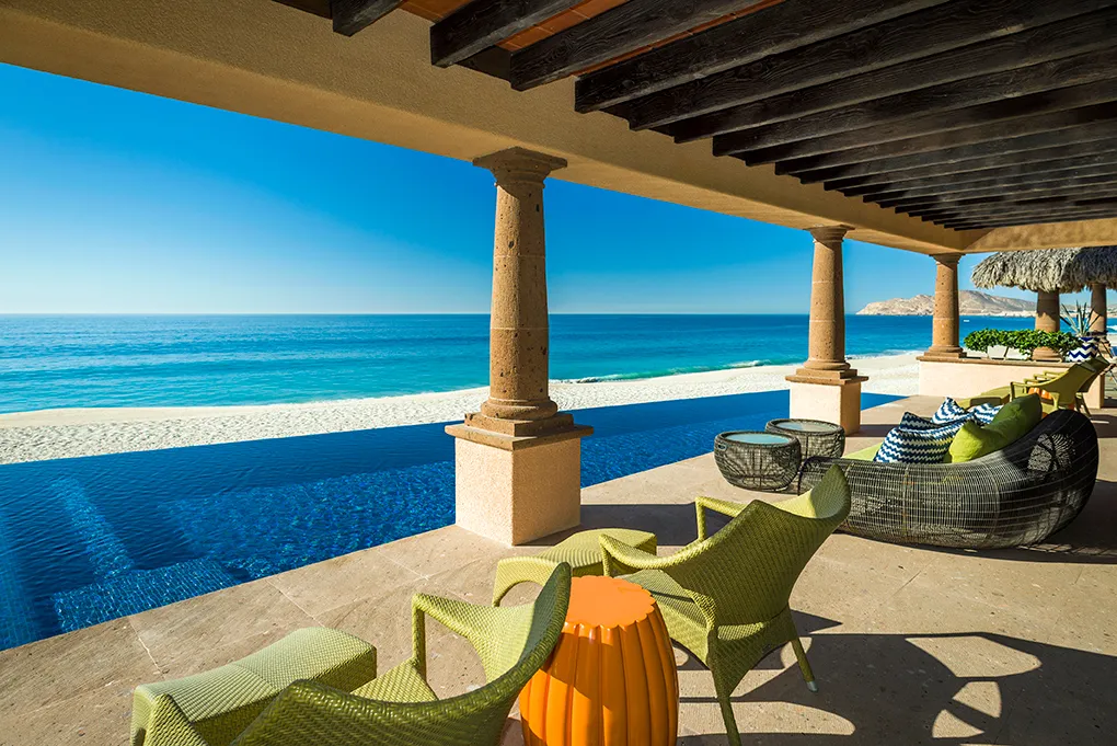 Beachfront infinity pool and shaded terrace at Casa Hidalgo overlooking the Sea of Cortez